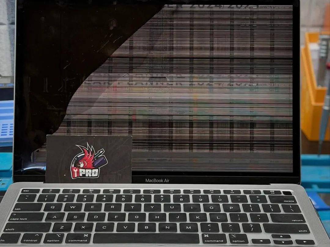 MacBook Air screen showing a dark patch and horizontal banding before repair